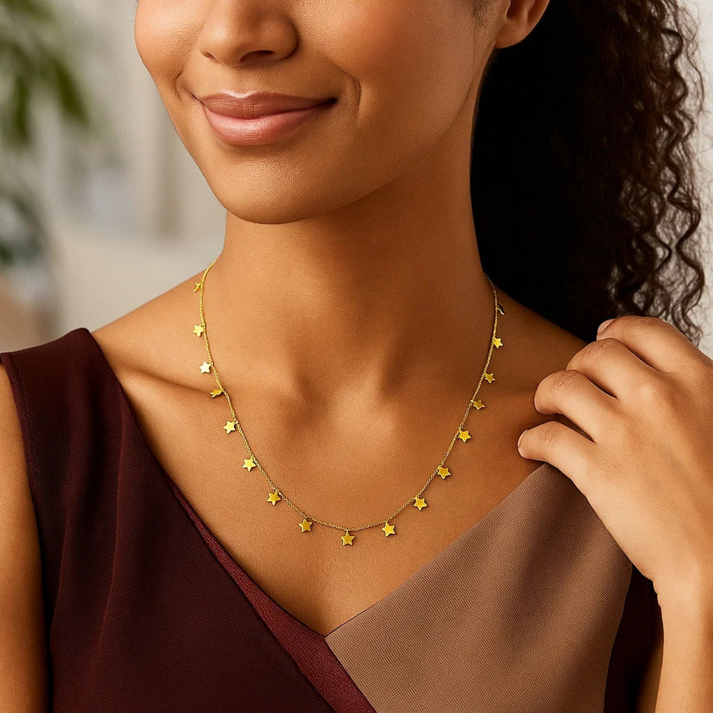 Cadena de oro amarillo de 14K con estrellas colgantes